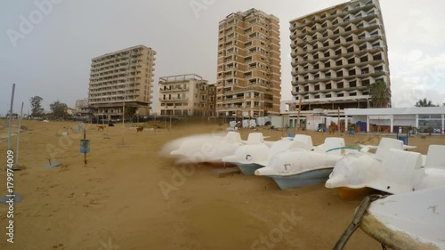 abandoned hotels and boats on the shores of the Mediterranean Sea, ghost town Varosha under rain in North Cyprus