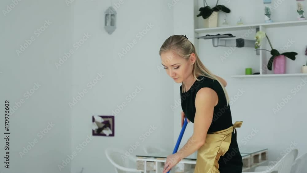 The maid washing the floor. The maid washing the floor.