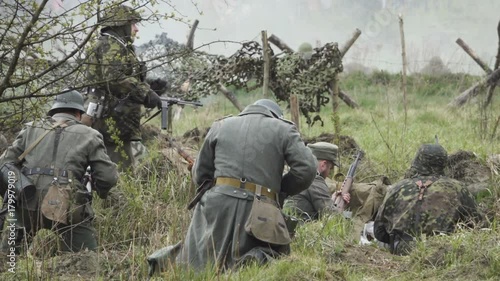 Historical reconstruction of Second World War. Soldiers on battle field during assault on Fort 5 in Koenigsberg. hostilities of Second World war. Slow Motion.