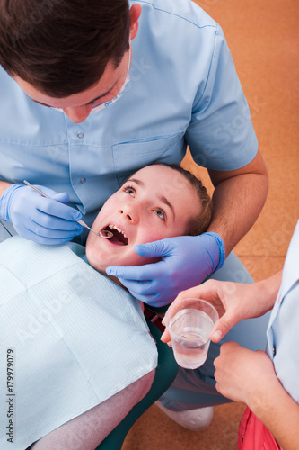 Dentist examines the teeth