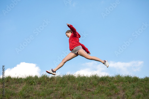 Running girl on blue sky 