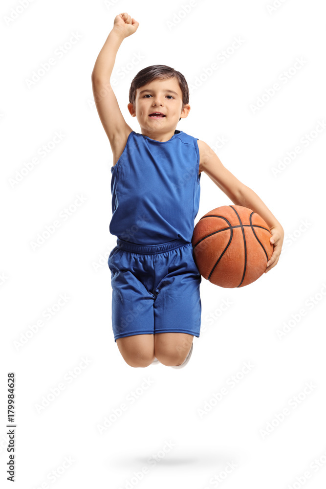 Overjoyed little basketball player jumping and gesturing happiness
