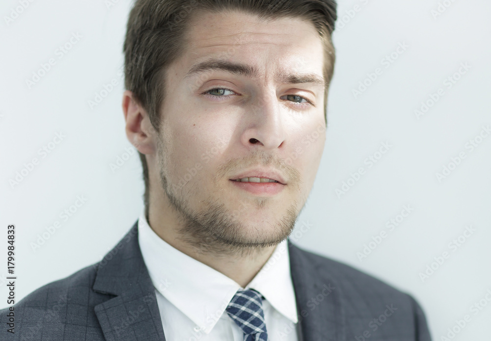 closeup.the face of a successful young man closeup.the face of a successful young man