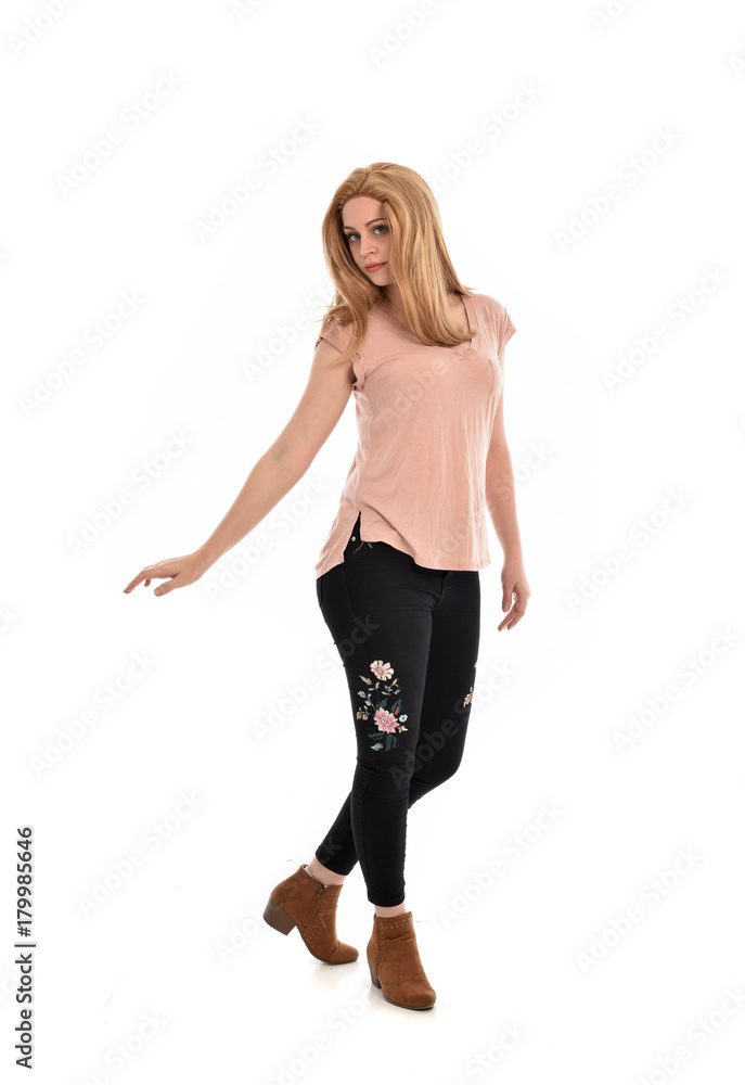 full length portrait of a girl wearing pink shirt and black floral pants. standing pose, isolated on a white background. full length portrait of a girl wearing pink shirt and black floral pants. standing pose, isolated on a white background.