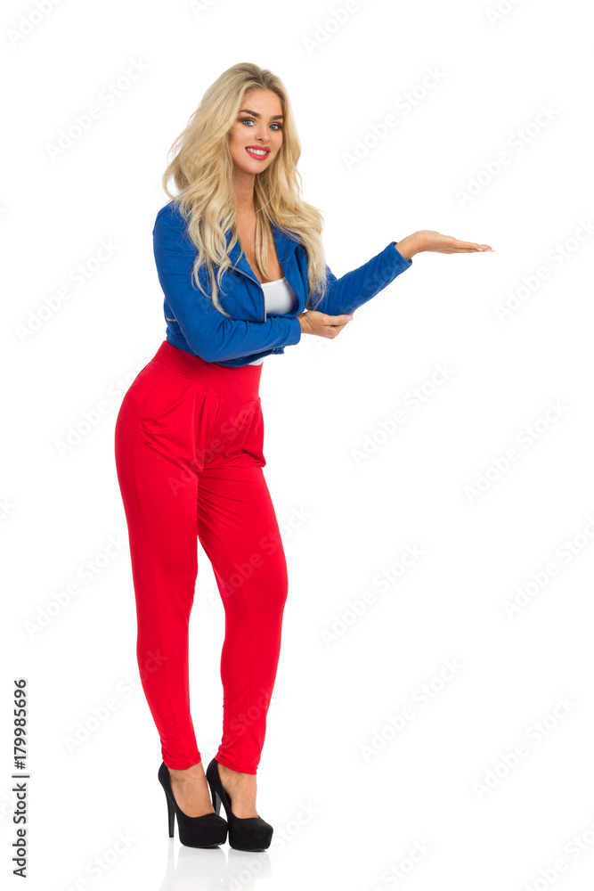 Smiling Sexy Woman Is Presenting Something On Her Hand Smiling Sexy Woman Is Presenting Something On Her Hand