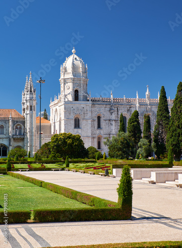 The view of Church of Santa Maria through the garden of Empire square. Lisbon, Portugal