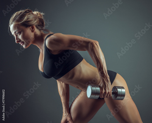 sportswoman with dumbbells