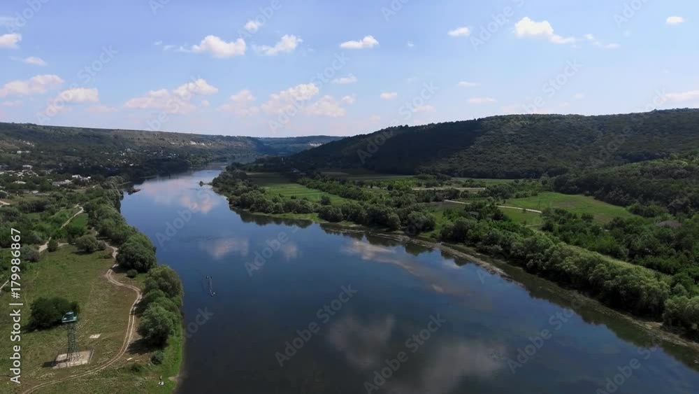 aerial view. Low flight over fresh cold river at sunny summer morning. aerial view. Low flight over fresh cold river at sunny summer morning.