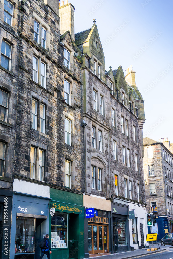 Fototapeta premium EDINBURGH, SCOTLAND - March 27, 2017: Street view of Historic Old Town Houses in Edinburgh, Scotland