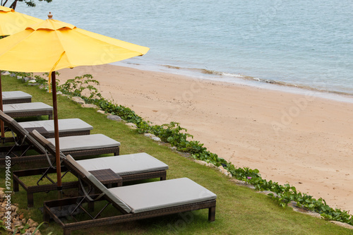 Outdoor beach chairs and yellow umbrellas