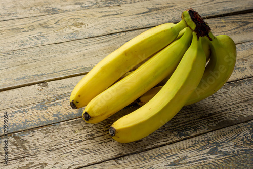 Tasty fresh ripe banana on a rustic wooden table