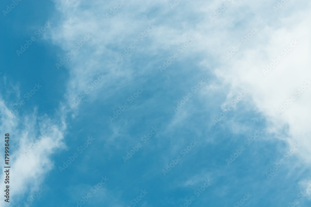 The blue backdrop has some clouds. The blue backdrop has some clouds.