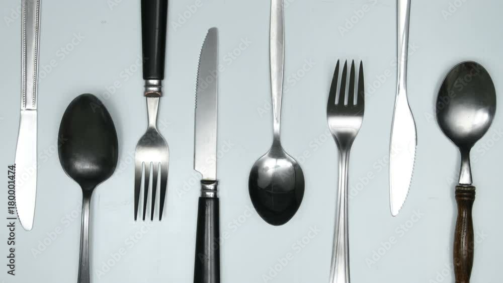 Moving cutlery on white and red background. Cooking jingle concept. Stop motion animation. Moving cutlery on white and red background. Cooking jingle concept. Stop motion animation.