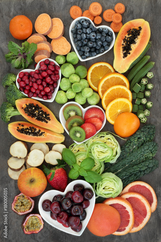 Fototapeta Naklejka Na Ścianę i Meble -  Super food for a high fibre diet with fresh fruit and vegetables, concept of foods high in smart carbohydrates, antioxidants and vitamins, on marble background, top view.