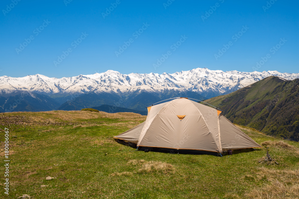 Tent on the green mountain meadow
