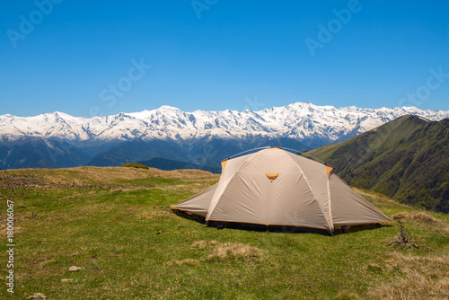 Tent on the green mountain meadow