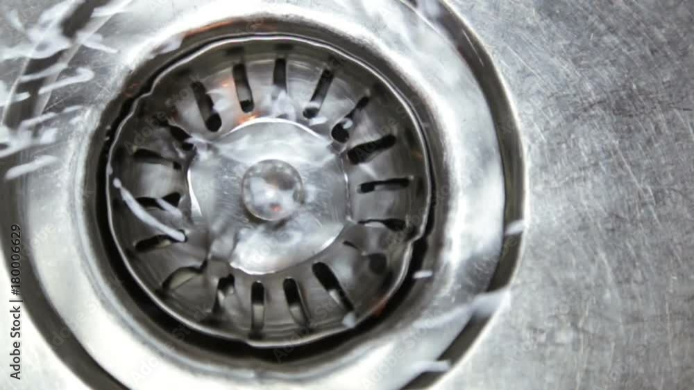 Water flows out of the kitchen sink Water flows out of the kitchen sink