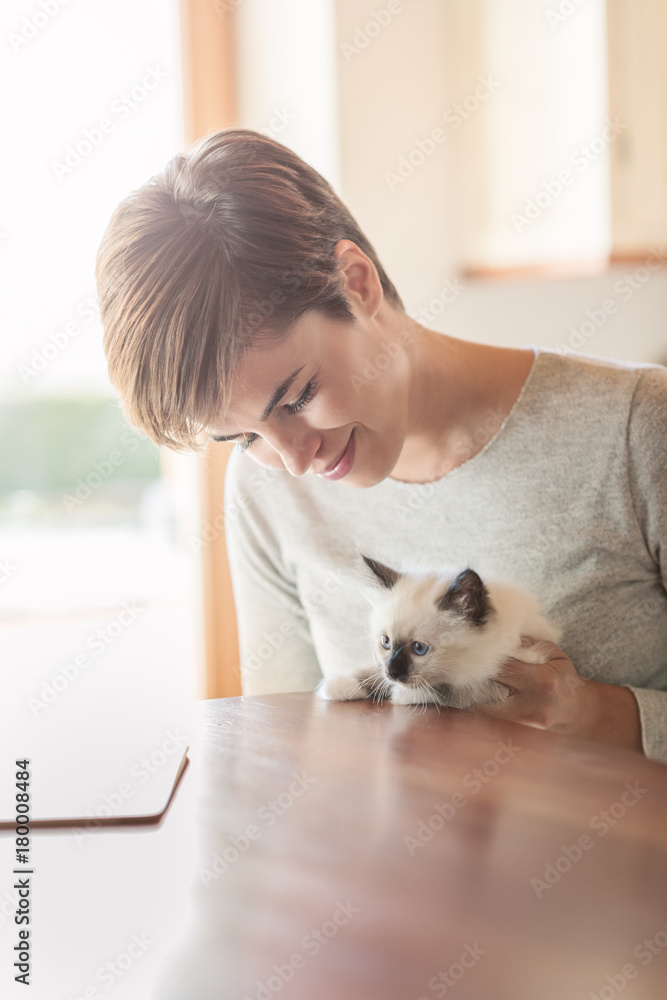 Woman holding her kitten