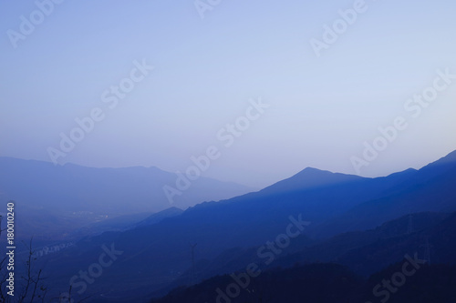 A view from mountains to the valley covered with smog.