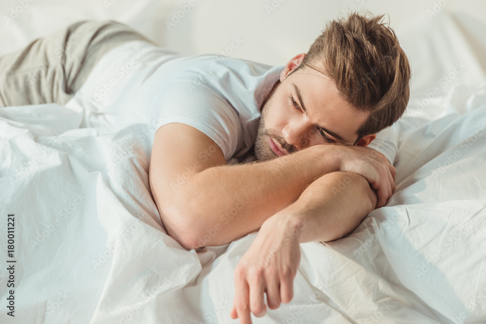 man relaxing in bed man relaxing in bed