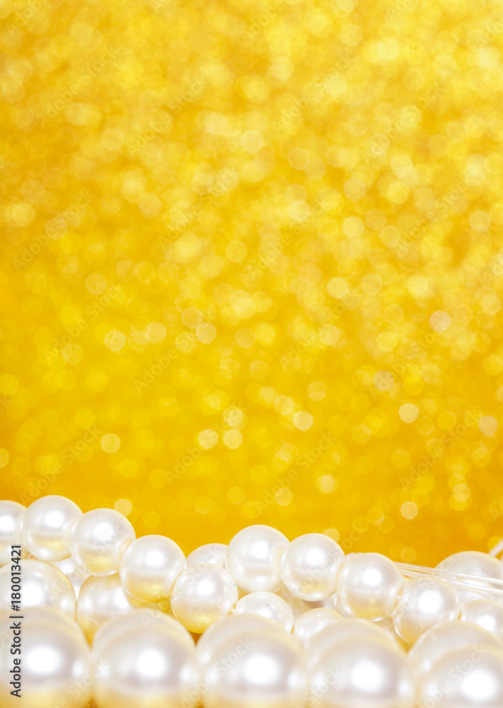 Pile of pearls on golden christmas background Pile of pearls on golden christmas background