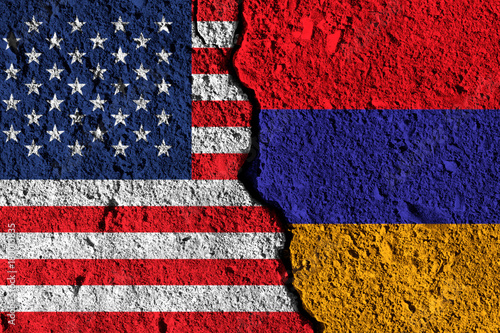 Crack between America and Armenia flags. political relationship concept
