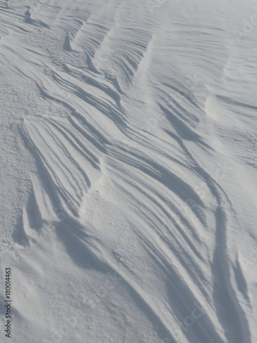 The texture of the frozen snow like a wave.