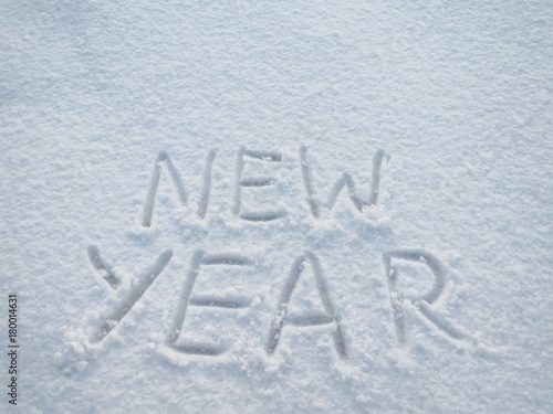 The words "new year" written in the snow.