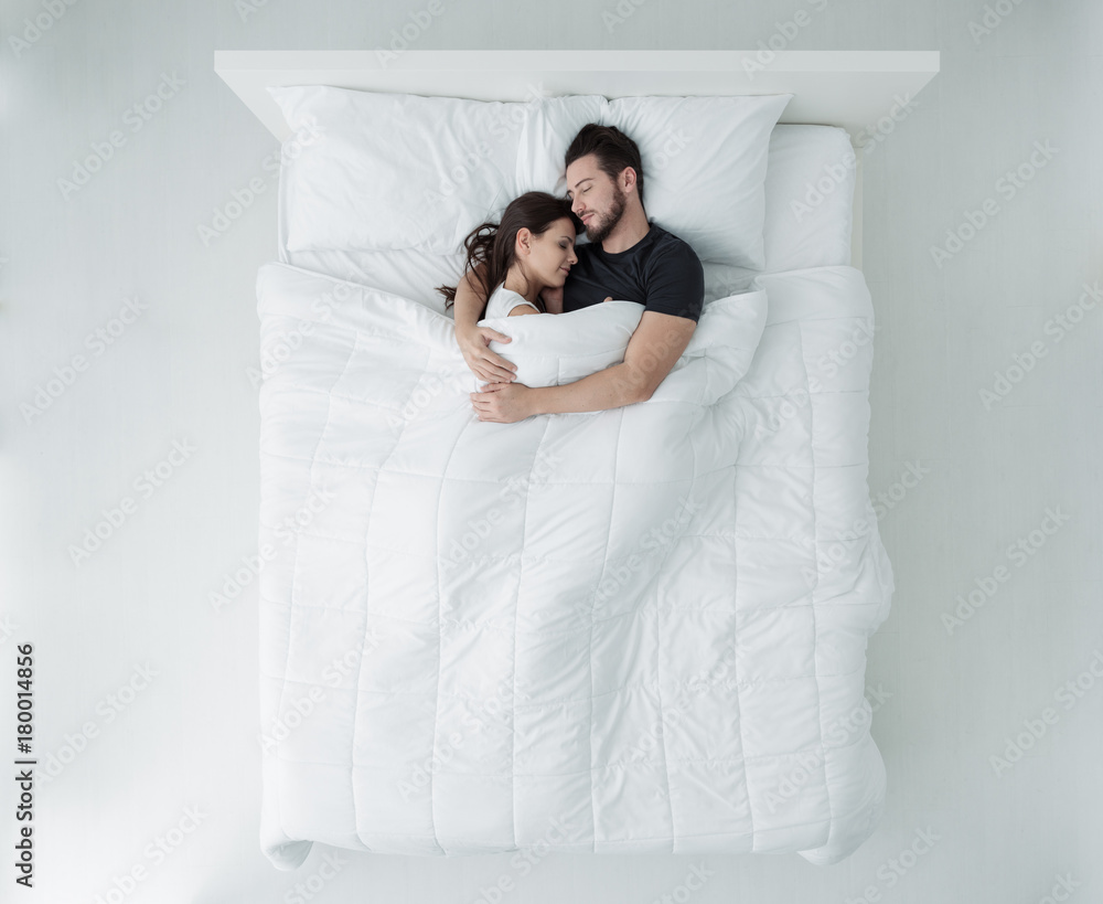 Фотография Loving couple in bed