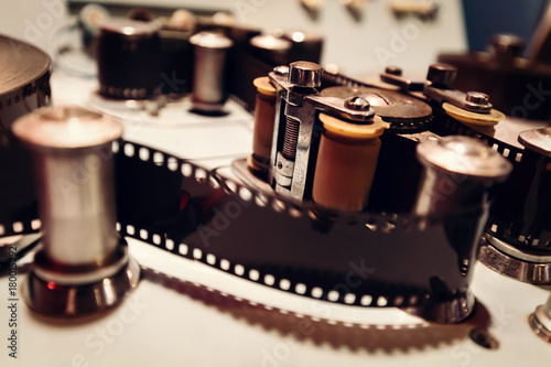 Fotografie Cinematic machine with film tape and reels.