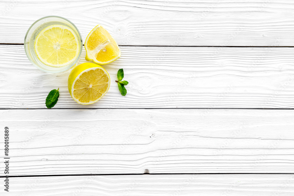 Glass of homemade lemonade on white wooden background top view copyspace Glass of homemade lemonade on white wooden background top view copyspace