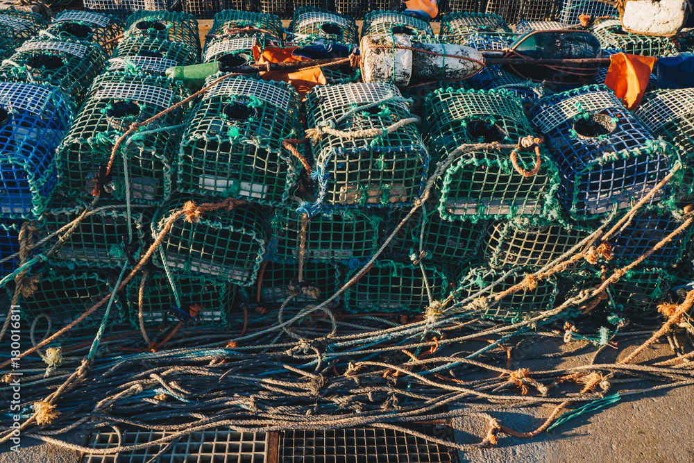 Lobster Fishing cages on the shore of a fishing harbour
