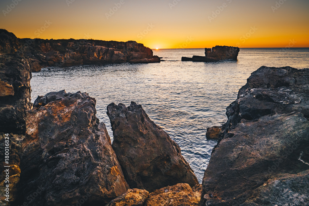 Sunset in Cascais, Portugal at Boca del Inferno famous spot for watching sunsets