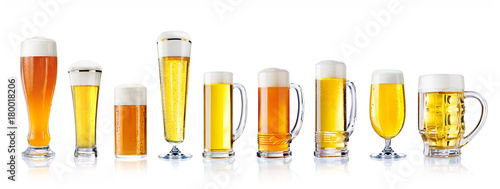 various types of fresh beer in glasses isolated on white
