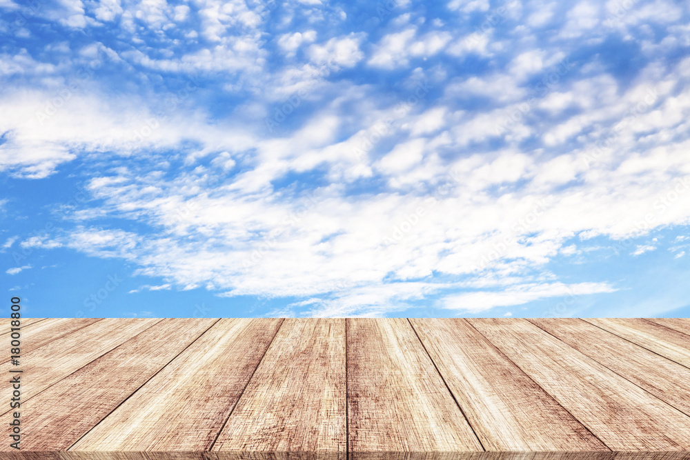 Wooden table and blue sky background Wooden table and blue sky background