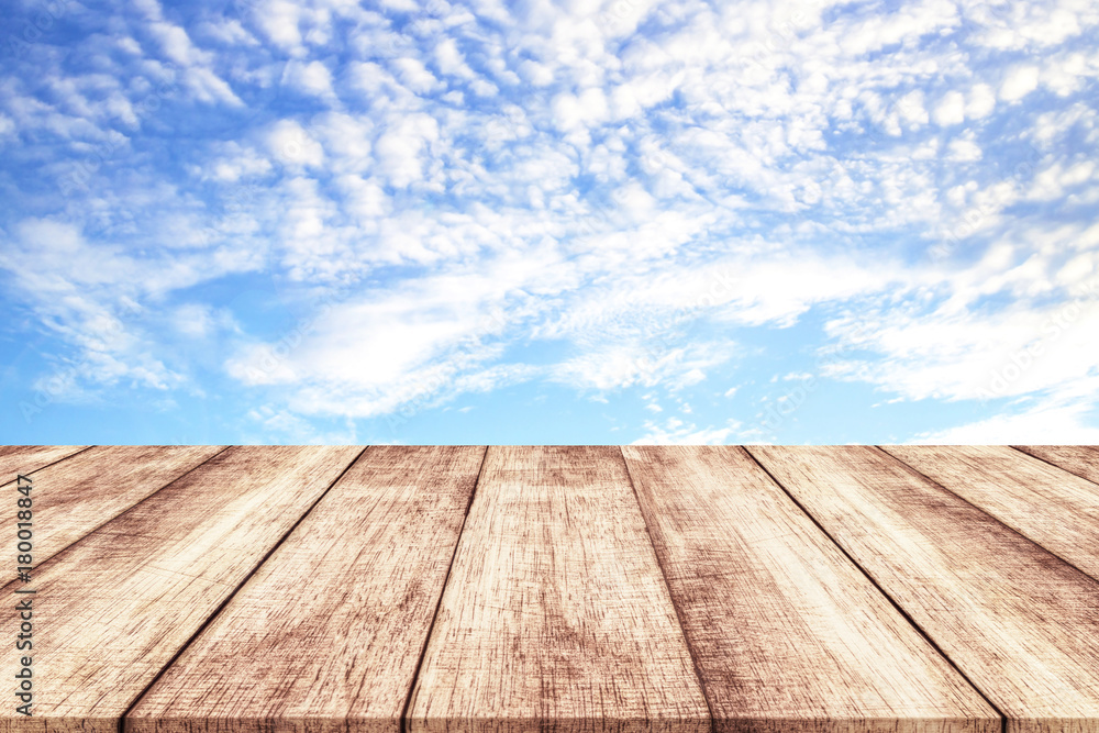 Wooden table and blue sky background