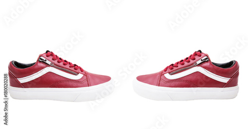 Fashion shoes with shoestring. Red sneaker and shoelace on white background