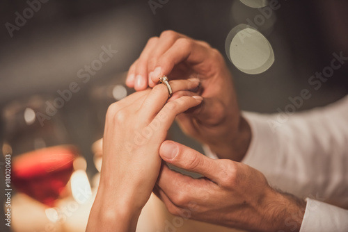 Man proposing in restaurant photo