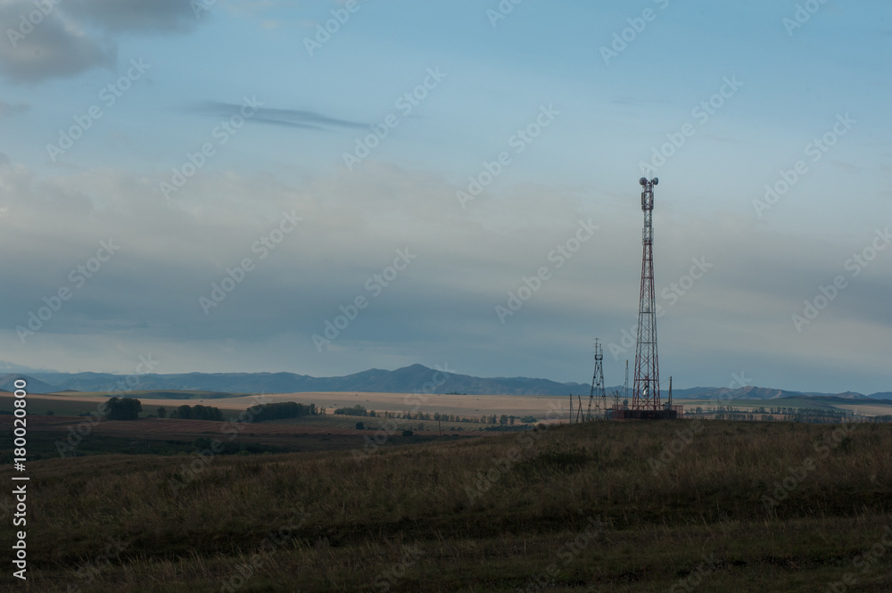 Telecommunications cell phone tower with antennas in a mountain location. Telecommunications cell phone tower with antennas in a mountain location.