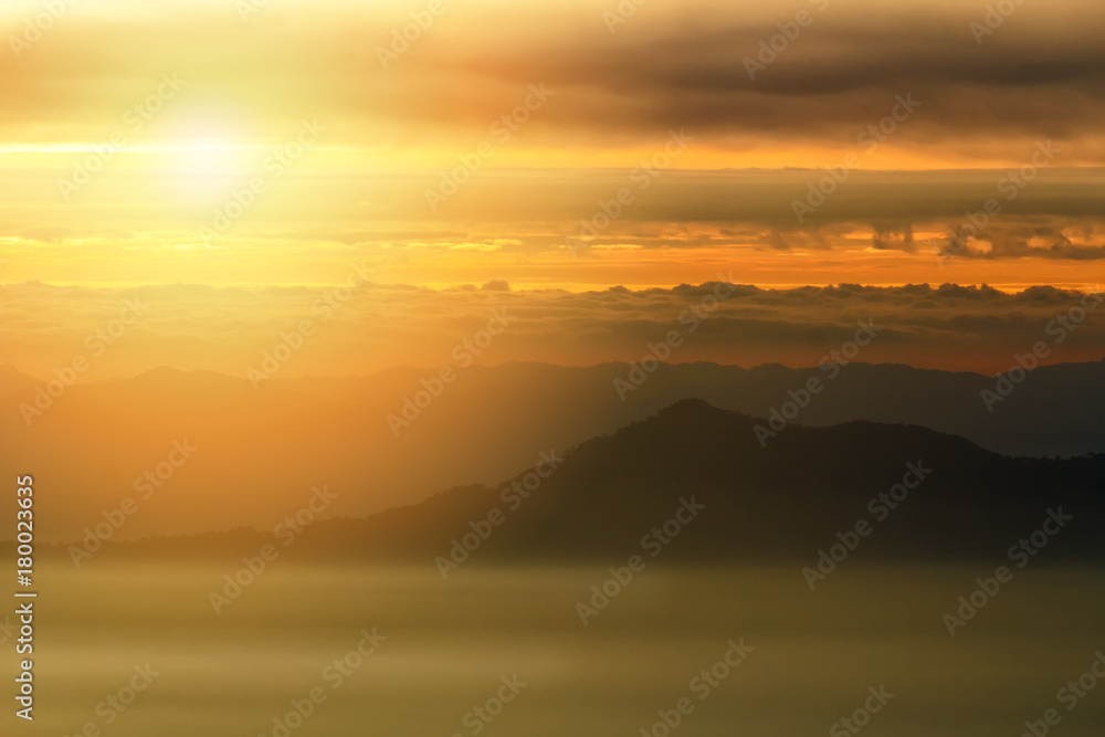 Sunriase with fog, mist and cloud cover the mountain at dawn