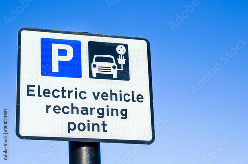 Recharging Point Road Sign with Blue Sky as Background