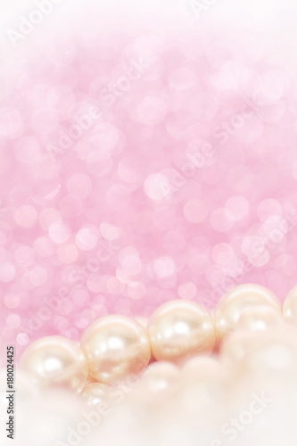 Pile of pearls on pink festive background
