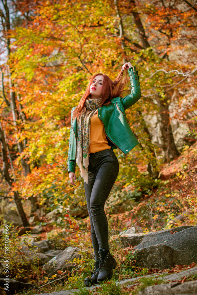 Beautiful hipster traveler with around autumn trees in woods. Stylish woman hiking. adventure and travel concept or rest at weekend on a nature, atmospheric moment Beautiful hipster traveler with around autumn trees in woods. Stylish woman hiking. adventure and travel concept or rest at weekend on a nature, atmospheric moment