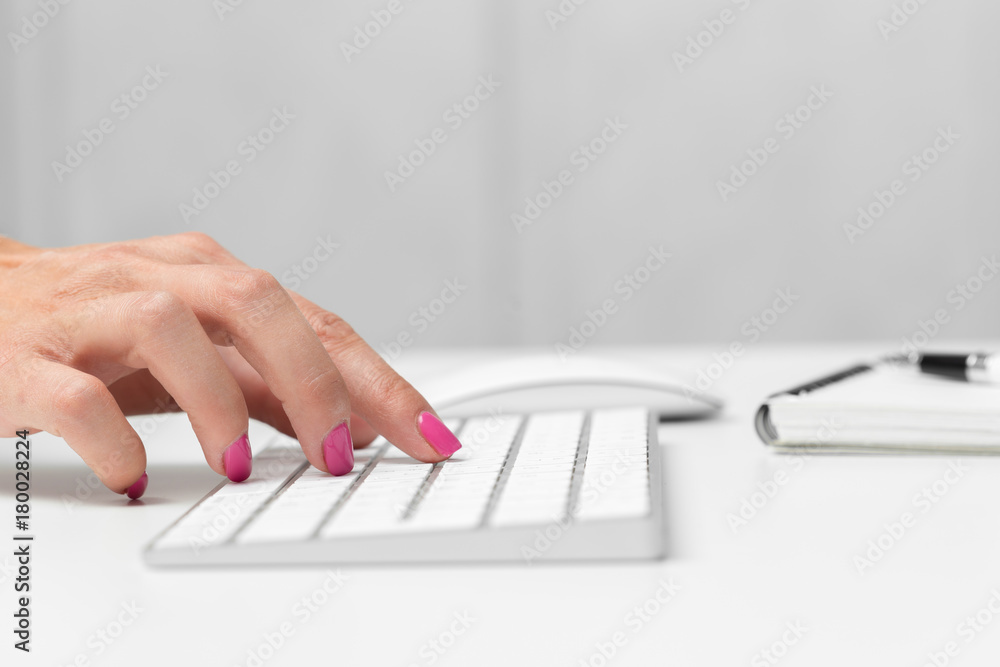Woman's hands on a keyboard