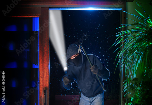 Принти на полотні Burglar just pried open a sliding glass door into a residential house