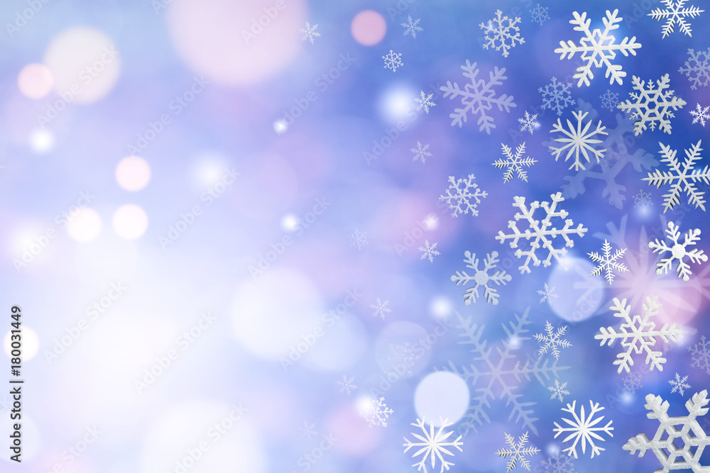 Christmas decoration with snowflakes on defocused blue background.