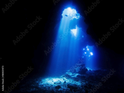 Cathedrals Dive Site Hawaii with Beams of Sunlight Entering Lava Cave