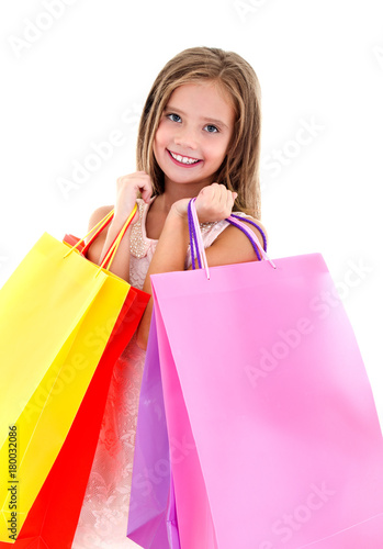 Adorable little girl child holding shopping colorful paper bags isolated