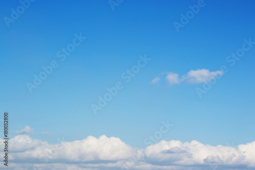 Fototapeta Naklejka Na Ścianę i Meble -  Bright Blue Sky and Fluffy Clouds on the horizon background.