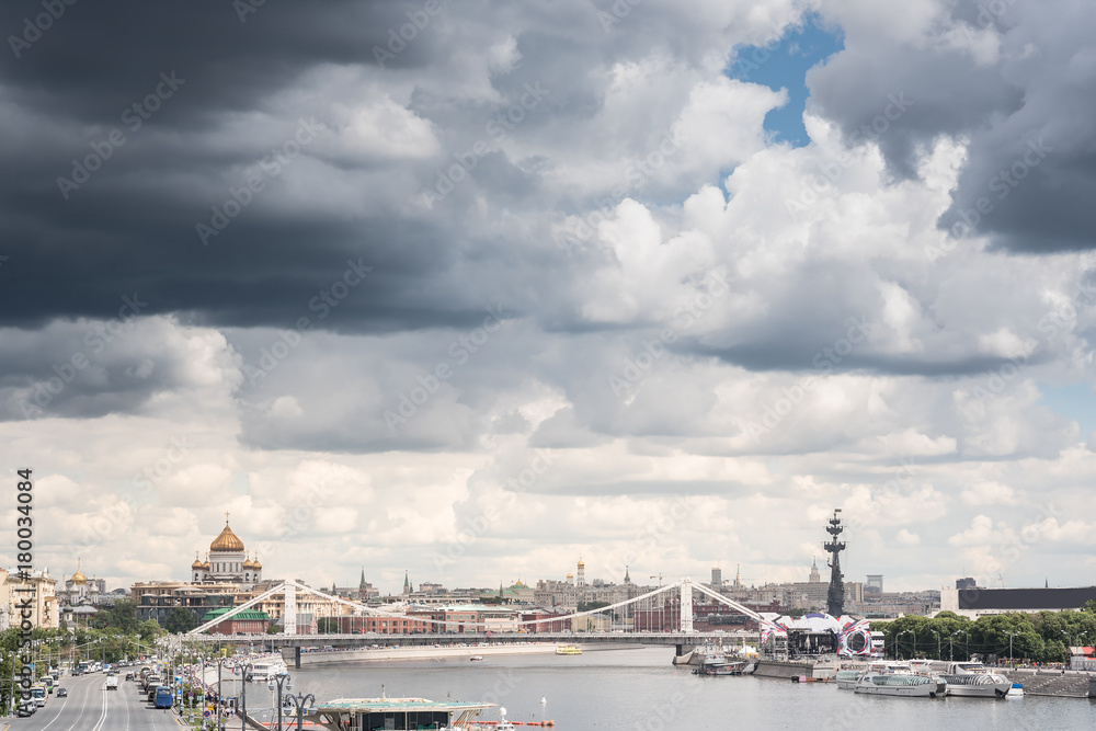 Amazing view of cathedral christ the savior and river, bridge, blue cloudy sky and people on a background. Moscow, Russia